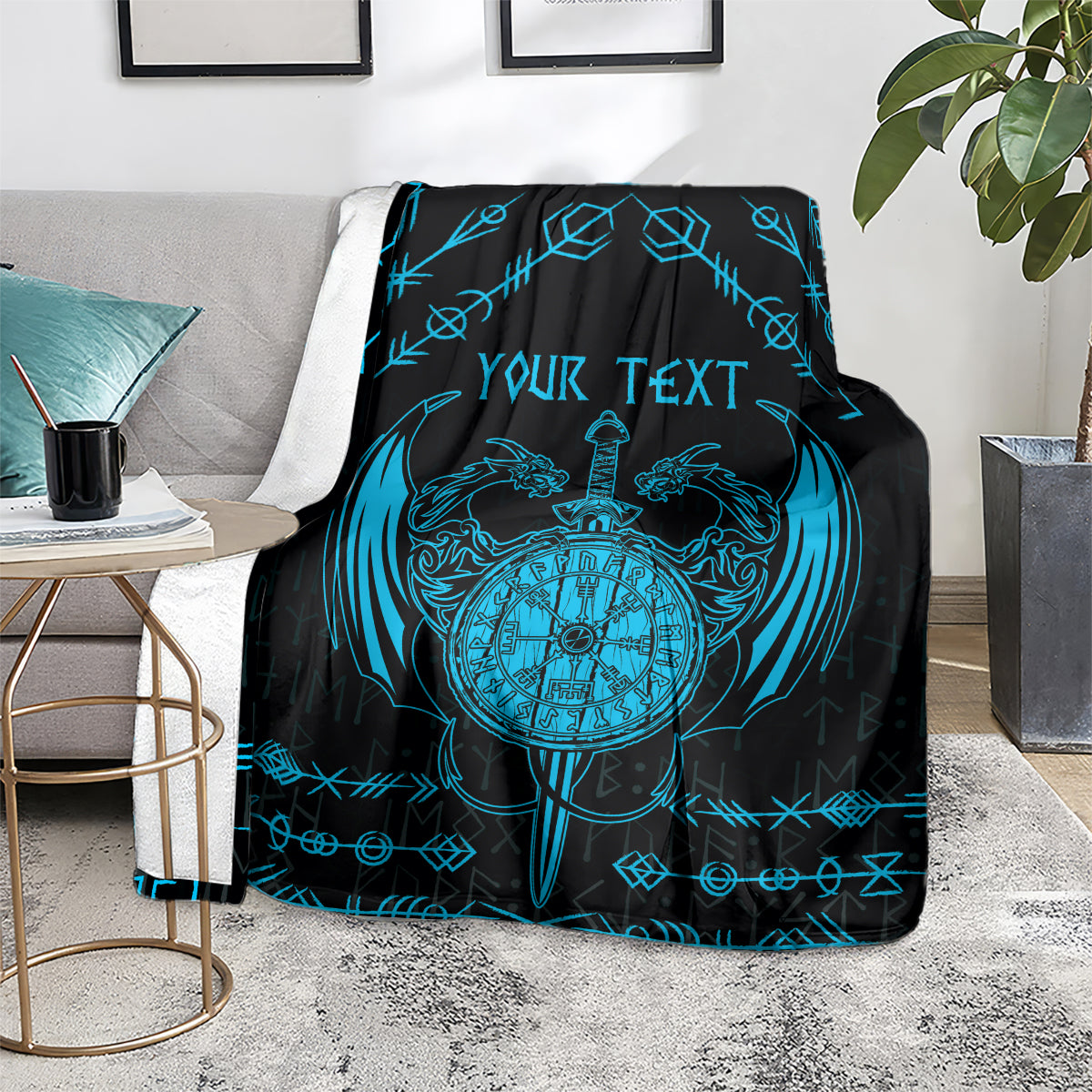 Black throw blanket with blue circular clock emblem, dragon wings, sword, and your text