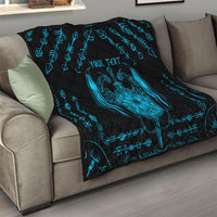 Black quilt draped on a sofa with blue Viking shield, runes, and Your Text.