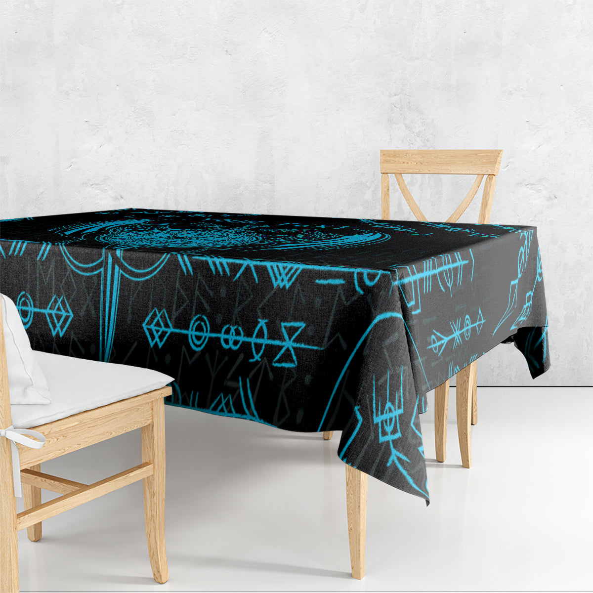 Blue and black Viking dragon tablecloth with rune symbols draped over table edges