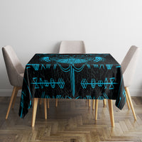 Blue and black Viking dragon tablecloth with rune symbols on a square table