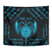 Close-up black and blue Viking dragon tapestry with winged crest and rune border