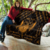 Black quilt with gold Viking dragon shield and sword tattoo, personalized text draped on couch
