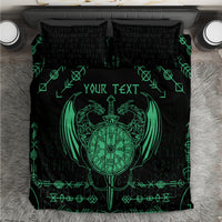 Black and green bedding set with dragon emblem, sword, and personalized text