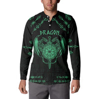 Black sweatshirt worn by model, green dragon crest sword graphic and rune pattern sleeves