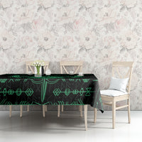 Black tablecloth with green rune motifs and decorative sword line art on table