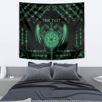 Black tapestry with green winged dragon heart shield and 'YOUR TEXT' over bed