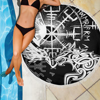 Round black beach blanket with raven and wolf artwork, fringed edge