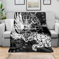 Black blanket with bold white raven and wolf illustration on couch