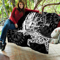 Black quilt laid out with white raven-and-wolf artwork and rune-shield center design.