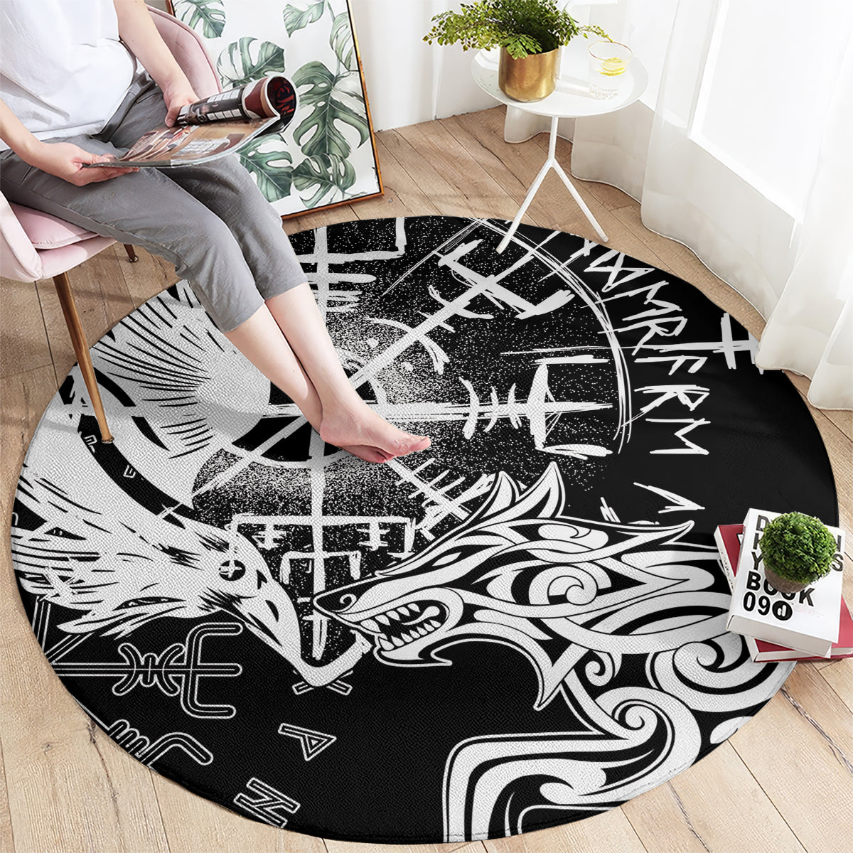 Round black rug with white Viking raven and wolf graphics, runes, and crossed emblem