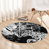 Round black area rug with white Viking raven, wolf, and runic emblem artwork