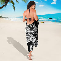 Black Viking sarong with white raven and wolf graphic, worn as a wrap at back