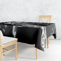 Black tablecloth with white Viking rune and raven patterns, draped over table