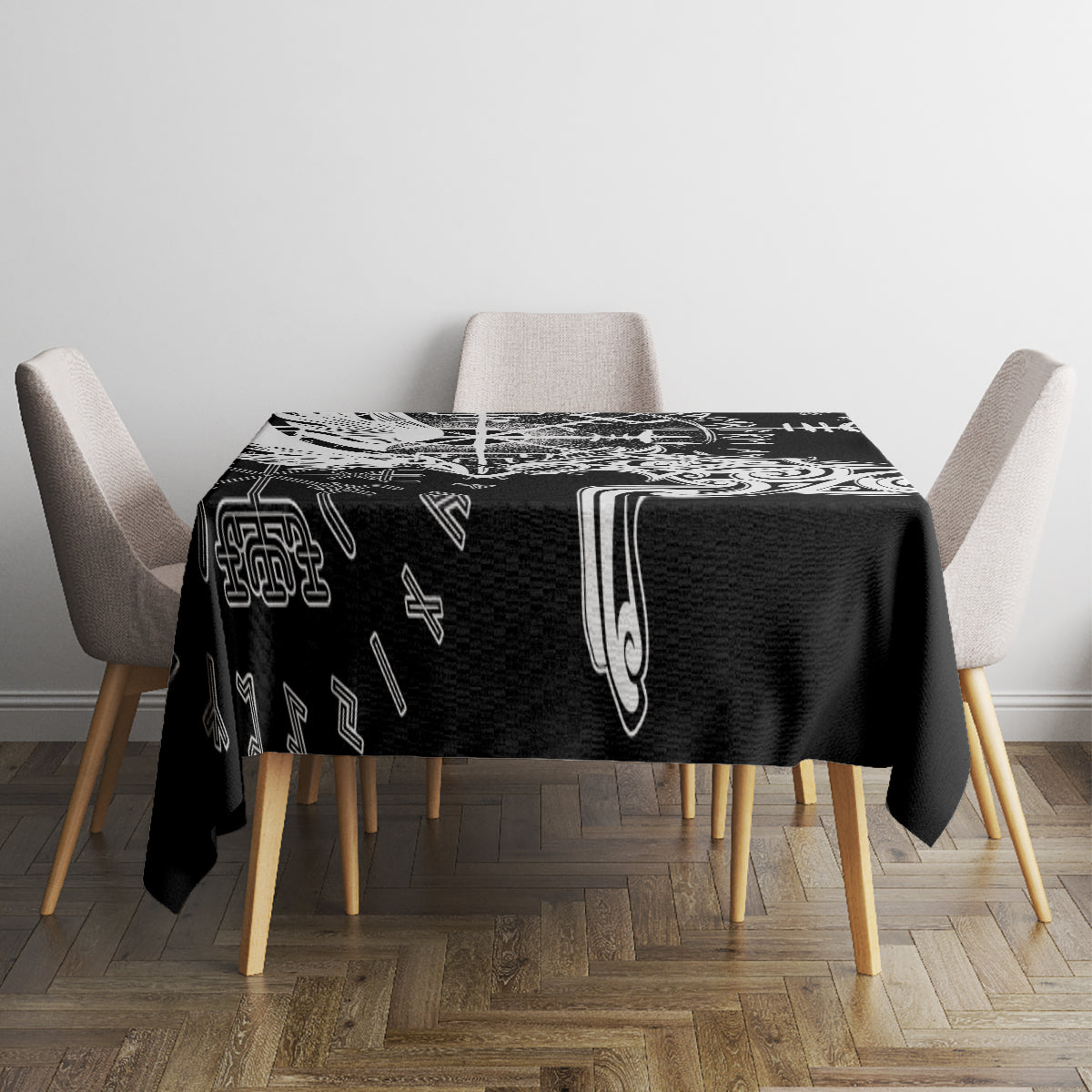 Black tablecloth with white Viking rune sigil design, centered on a dining table