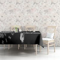 Black tablecloth with white Viking rune sigil design, draped across the table