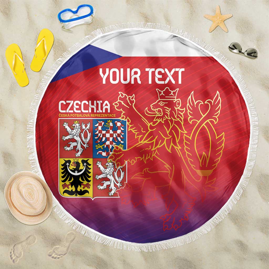 Red round beach blanket with Czech flag crest and lion graphic, white fringed edge