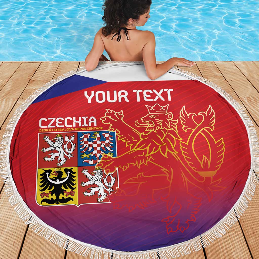 Round red Czech beach blanket with lion graphic and Czech crest, white fringe edge