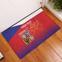 Red, blue and purple Czech lion rubber doormat with customizable text near doorway