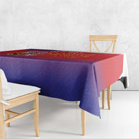 Red and blue gradient tablecloth draped over rectangular table with lion crest
