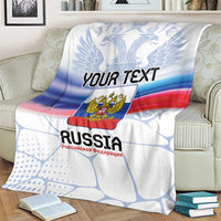 Personalized Russia blanket on armchair with “YOUR TEXT”, eagle crest, blue red stripes