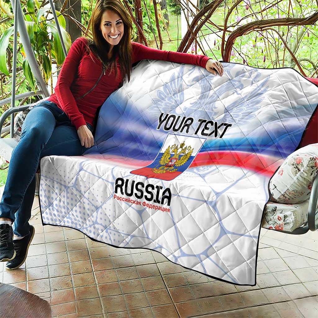 Personalized Russia quilt draped over couch with eagle crest and tricolor flag stripes