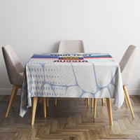 Personalized Russia tablecloth on round dining table, white and blue with central crest