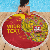 Red round beach blanket with white fringe, double-headed eagle crest and YOUR TEXT