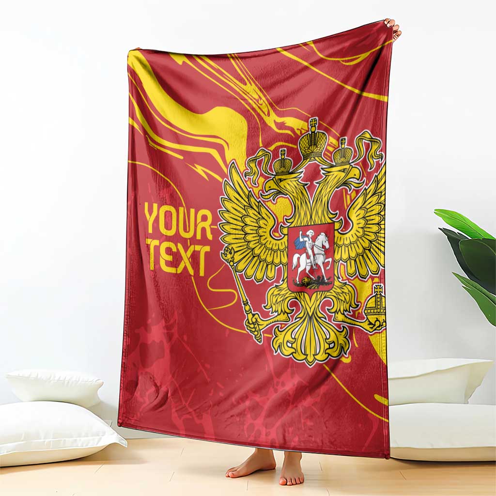 Red double-headed eagle blanket with gold crest and custom text, hanging over floor