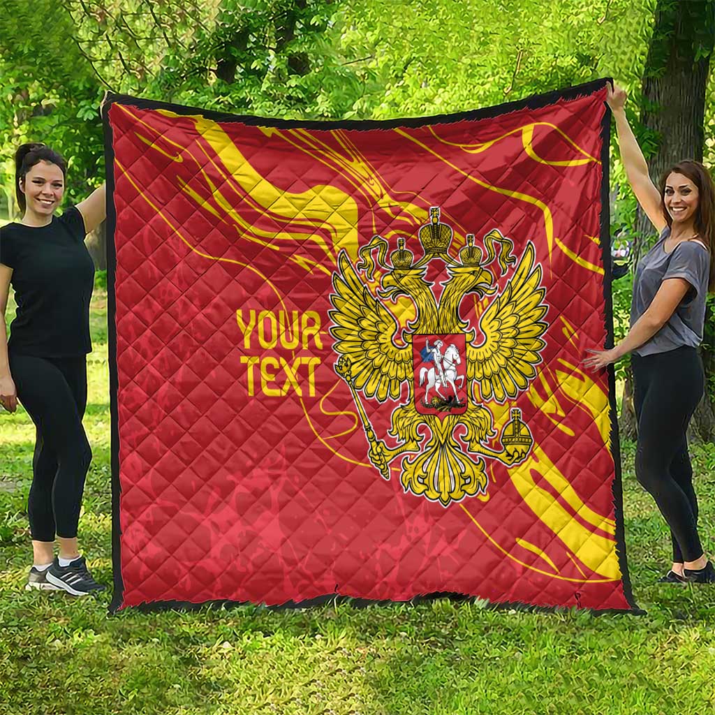 Red quilt with yellow swirls and double-headed eagle emblem, personalized text shown