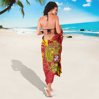 Red sarong wrap with double-headed eagle crest and vertical yellow wave design