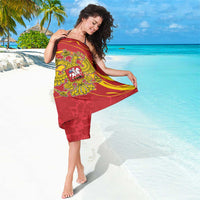 Red sarong wrap with double-headed eagle crest, yellow wave pattern and draped fit