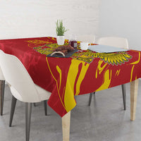 Red tablecloth with gold double-headed eagle motif across the table surface