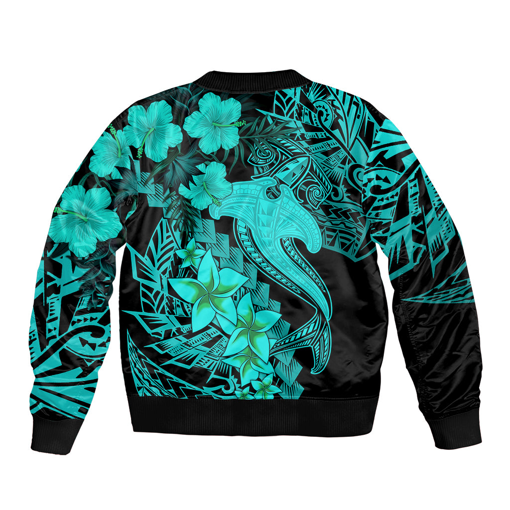 Unisex bomber jacket with large turquoise tribal tattoo graphic, black ribbed hem.