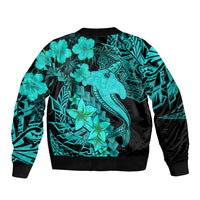 Unisex bomber jacket with large turquoise tribal tattoo graphic, black ribbed hem.