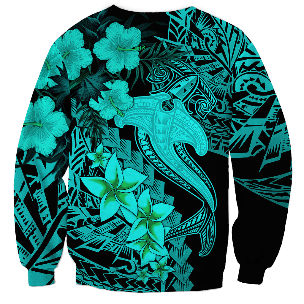 Turquoise unisex sweatshirt with tribal pattern, shark tattoo, and hibiscus flowers
