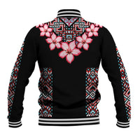 Black baseball jacket with pink hibiscus flowers and tribal geometric pattern sleeves.