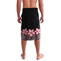 Black wrap skirt with pink hibiscus print and blue geometric trim, back view