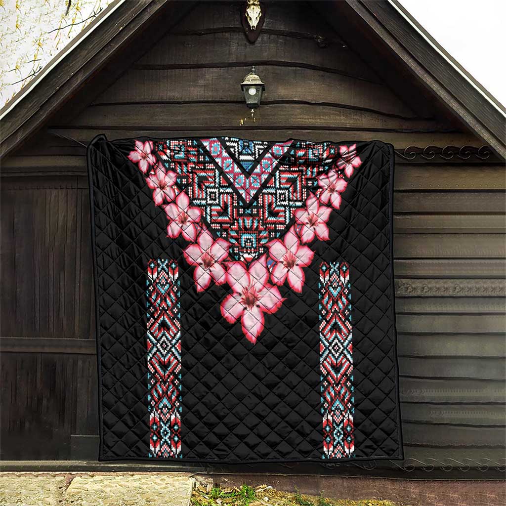 Black quilt blanket with pink flower centerpiece and colorful tribal side bands