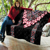 Black quilt blanket with pink blossoms and multicolor geometric center and side accents