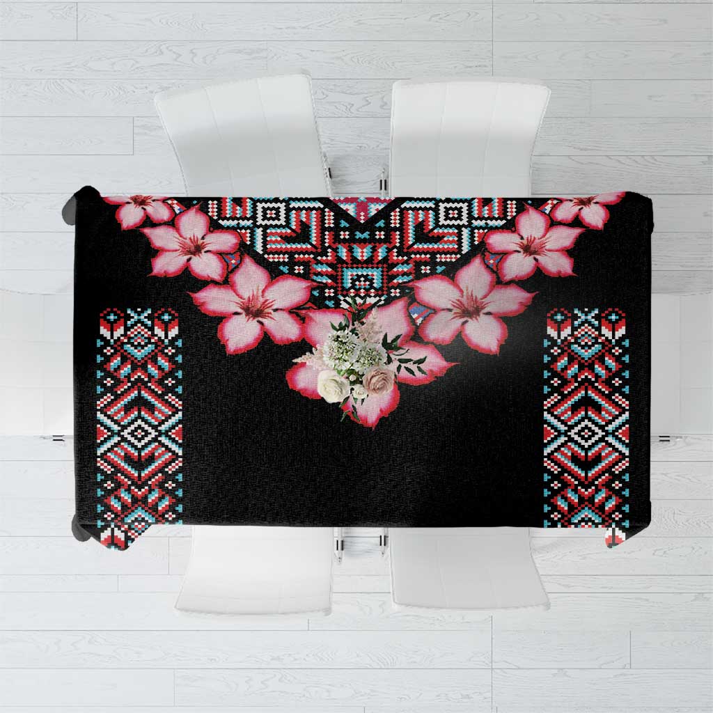 Black tablecloth with red flower motif and colorful tribal border
