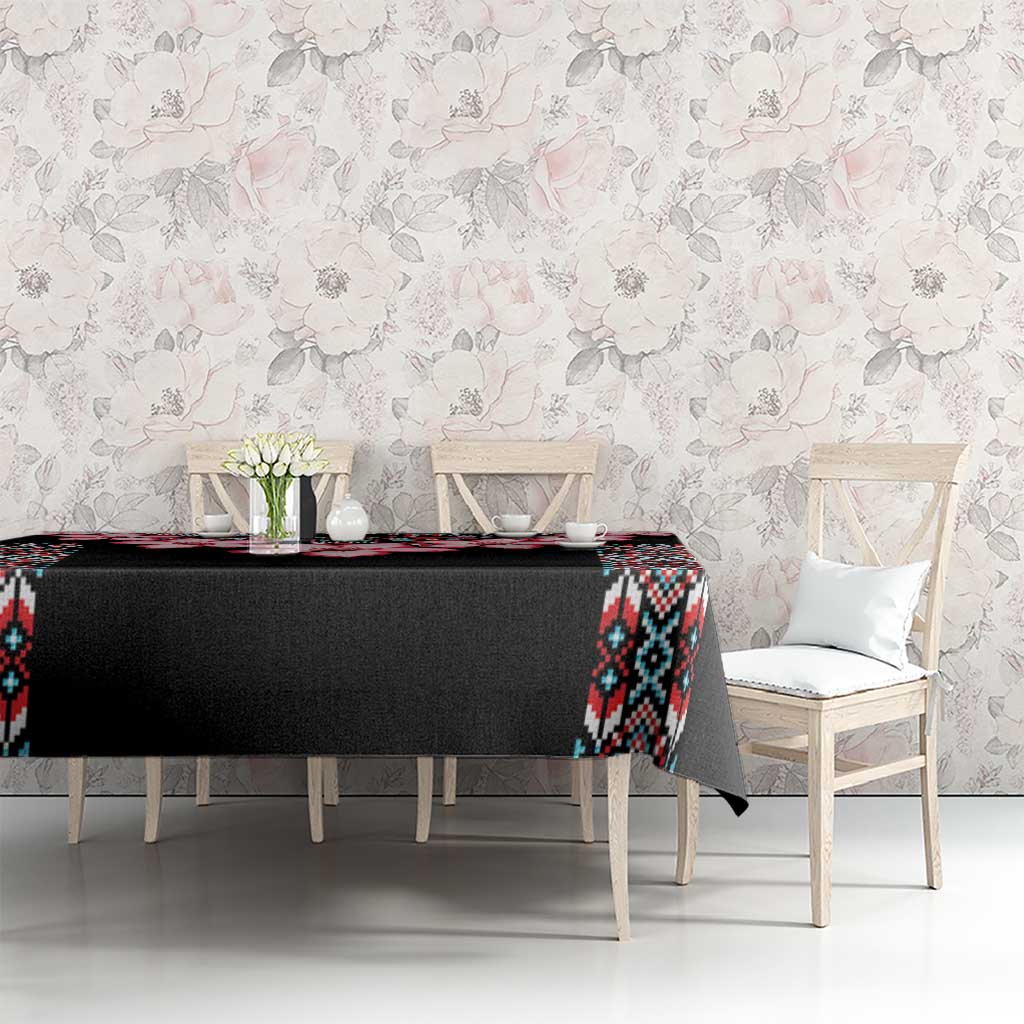 Black tablecloth with red flower motif and colorful tribal side pattern