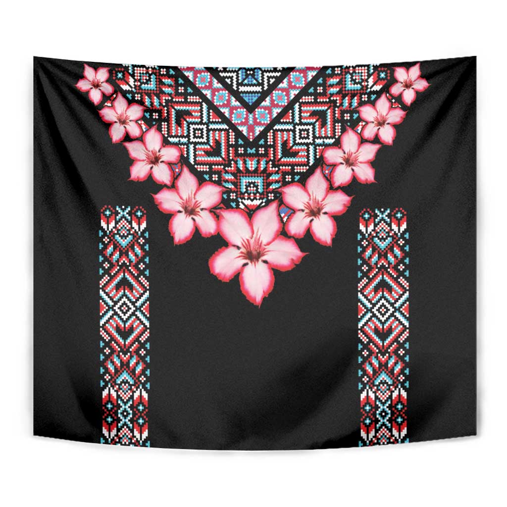 Black tapestry with pink hibiscus-style flowers and colorful patterned center