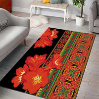 Black area rug with red and orange Clivia flower print and ornate multicolor border