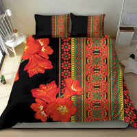 Black bedding set with orange-red floral panel, multicolor geometric stripes, and matching shams