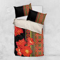 Black bedding set with orange-red flowers, vertical decorative border, and two black pillowcases