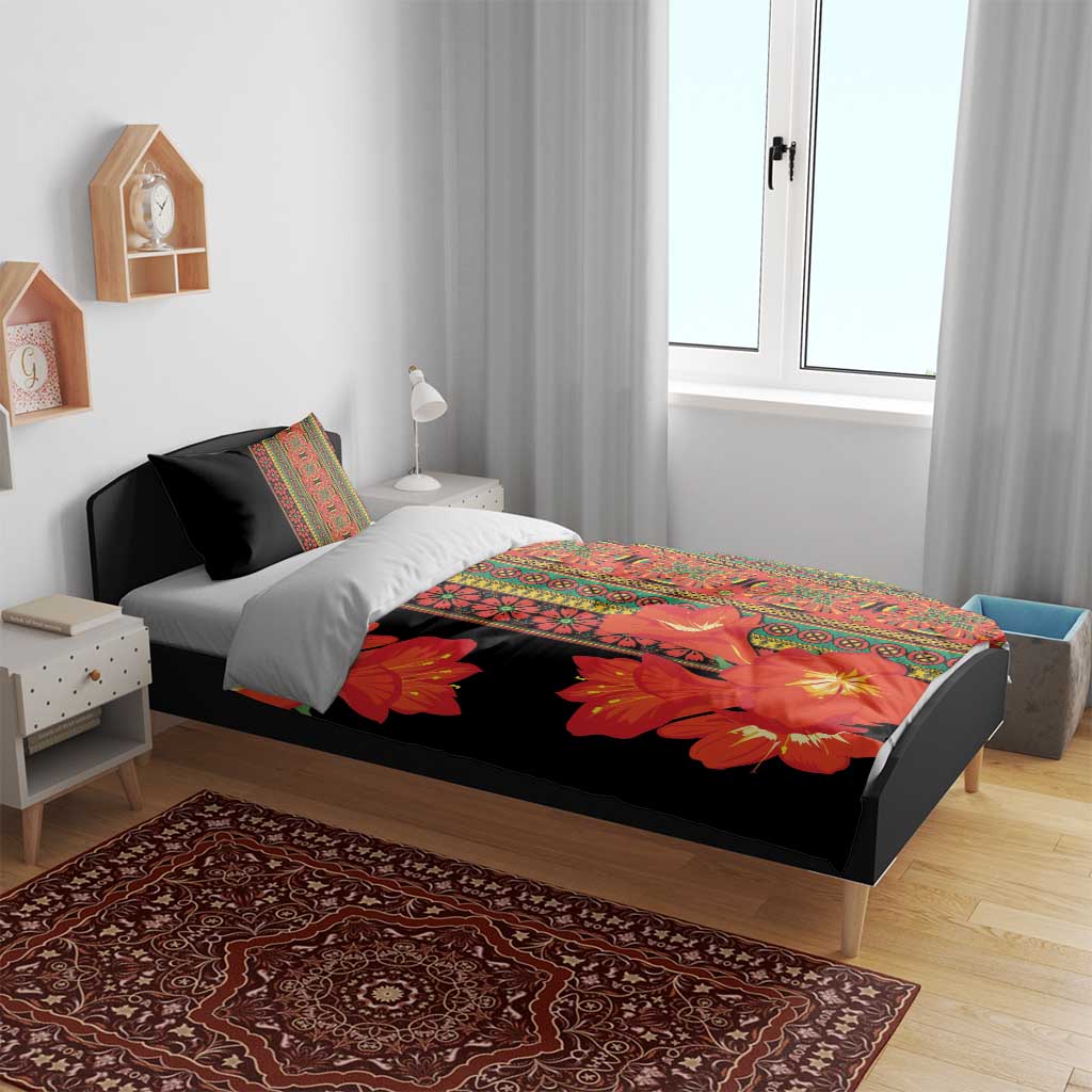 Black duvet bedding set with orange-red flowers and multicolor stripe border on bed