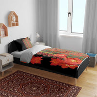 Black duvet bedding set with orange-red flowers and multicolor stripe border on bed
