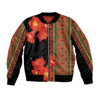 Unisex bomber jacket: black with orange clivia floral print and colorful patterned stripe