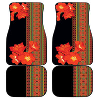 Set of 4 black car floor mats with orange clivia-style flowers and green decorative trim