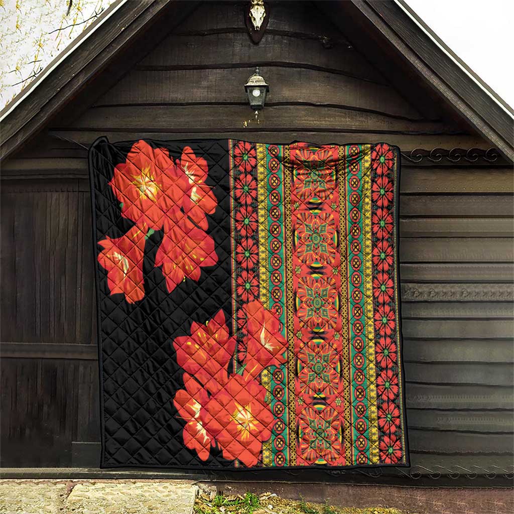 Black quilt with red-orange flowers and green-yellow multicolor vertical border design